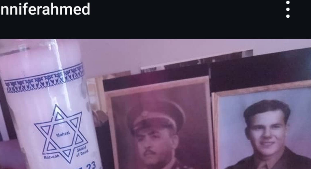 Jennifer Jorgensen Ahmed's family portraits in uniform beside a Shield of David memorial candle