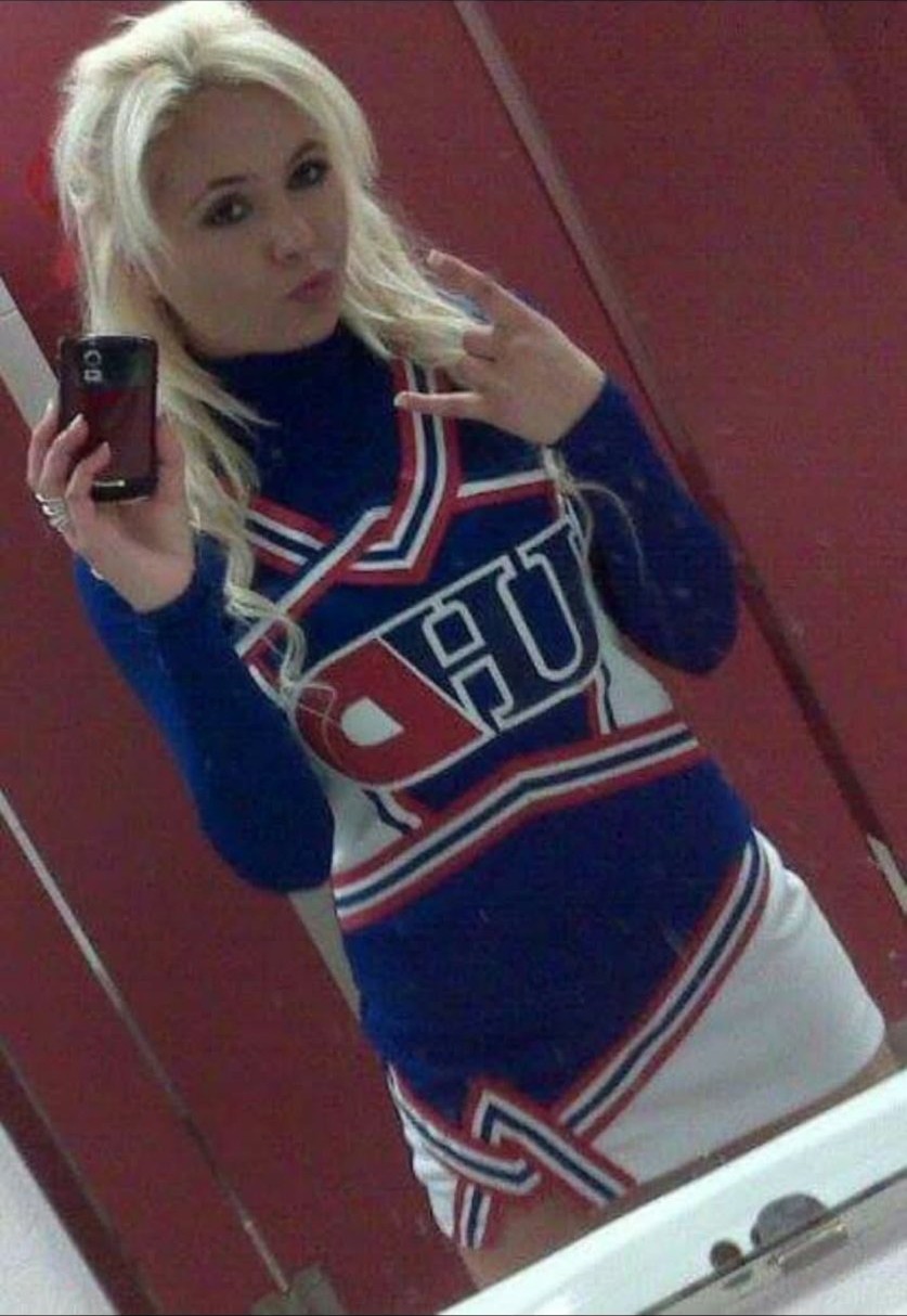 Jennifer Jorgensen Ahmed in her University of Houston Downtown cheer uniform, mirror selfie