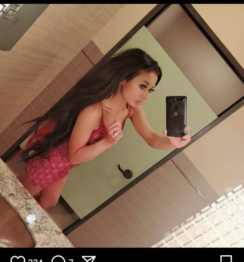 Jennifer Jorgensen Ahmed in a red dress, mirror selfie