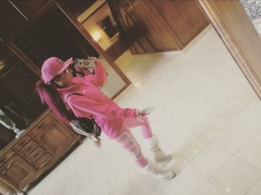 Jennifer Jorgensen Ahmed in a pink outfit, mirror selfie