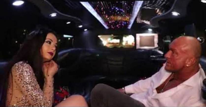 Jennifer Jorgensen Ahmed with a companion in a limousine