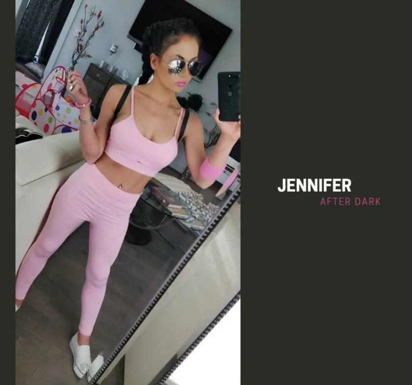Jennifer Jorgensen Ahmed in a pink workout outfit, mirror selfie