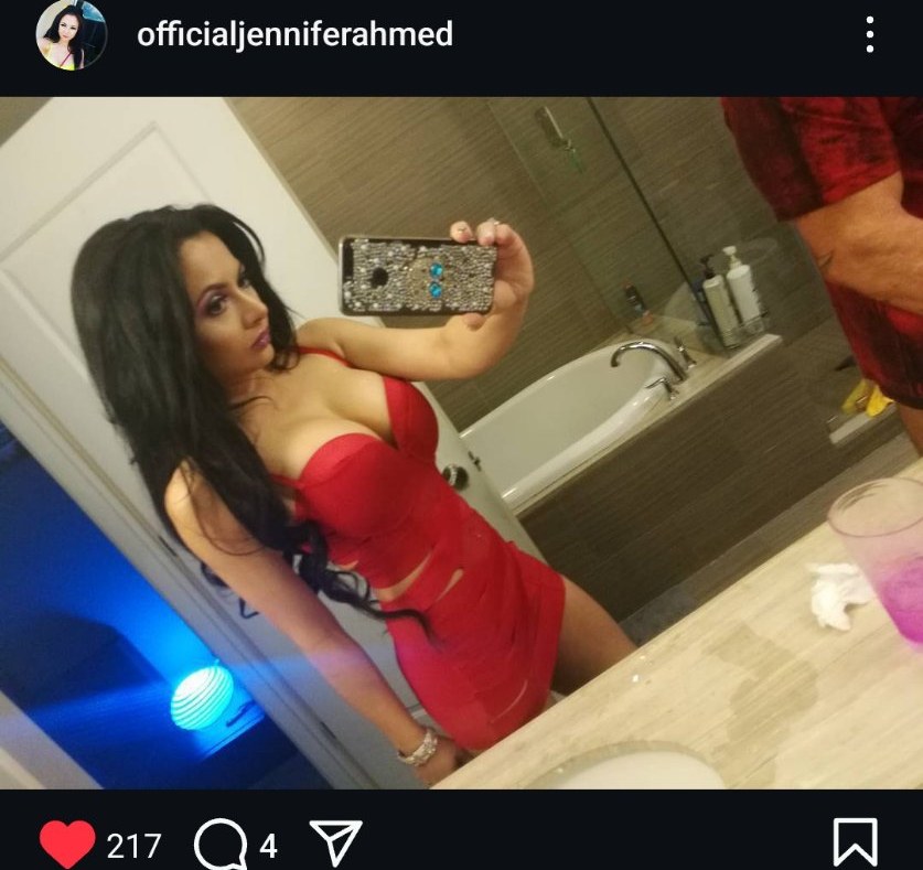 Jennifer Jorgensen Ahmed in a red dress, mirror selfie